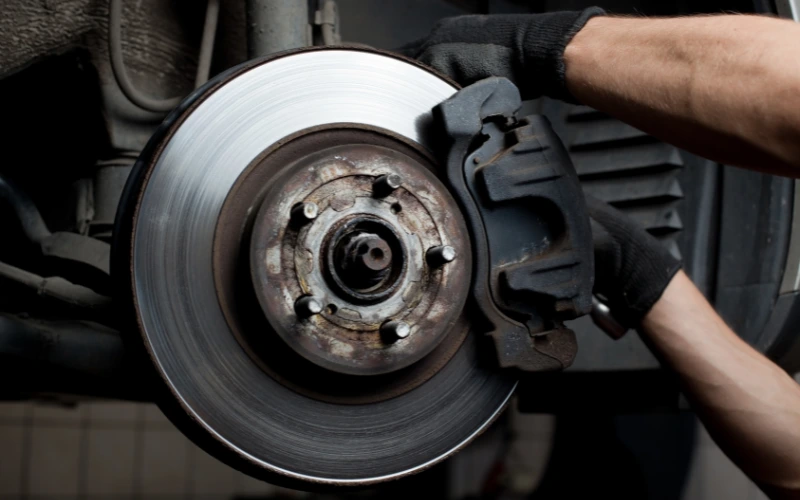Close up of car brake pads and disc.