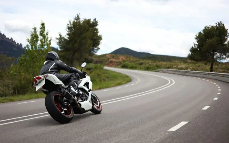 Motorcyclist driving round a bend on the openroad 