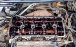 Image of a car engine covered in oil sludge