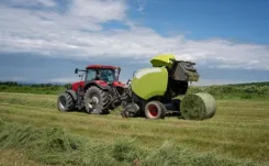 Red tractor working in a field