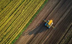 Ariel shot of tractor spraying crops